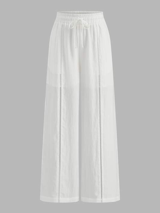 Pantalón ancho de tiro medio con cintura ajustable y calados