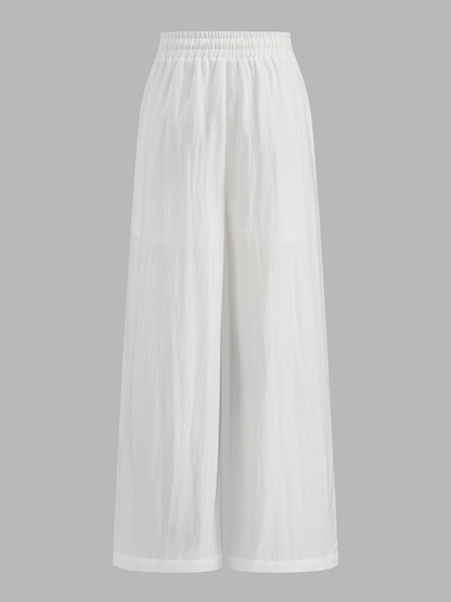 Pantalón ancho de tiro medio con cintura ajustable y calados