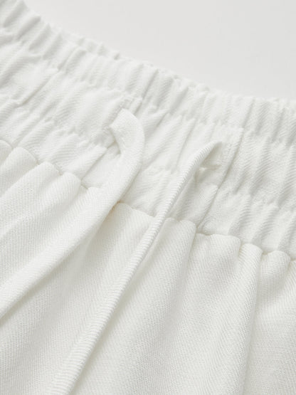 Pantalón ancho de tiro medio con cintura ajustable y calados