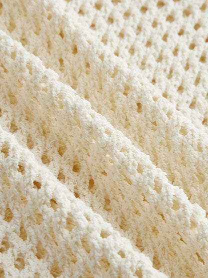 Top de punto de crochet calado con manga corta