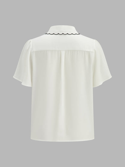 Blusa de manga farol con borde ondulado en contraste